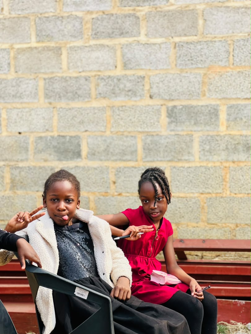 Parents seated on the mat with their infants